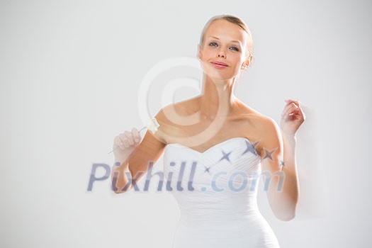 Gorgeous bride dancing, holding a rose (moiton blur technique used to convey the movement) Gorgeous bride dancing, holding a rose (moiton blur technique used to convey the movement)