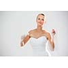 Gorgeous bride dancing, holding a rose (moiton blur technique used to convey the movement)