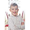 Happy young boy portrait at home. Smile without teeth.