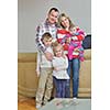 hapy young family have fun  with their children at modern living room home indoors