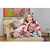 hapy young family have fun  with their children at modern living room home indoors