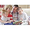 hapy young family have fun  with their children at modern living room home indoors
