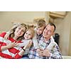 hapy young family have fun  with their children at modern living room home indoors