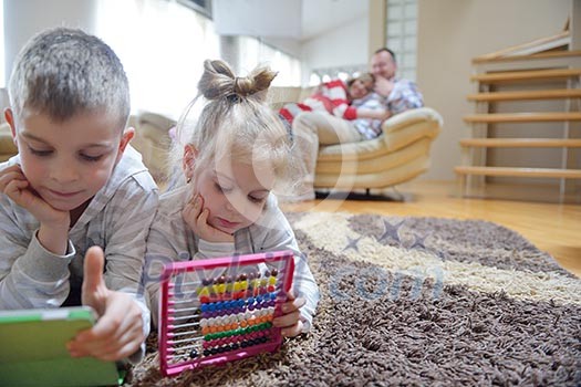 hapy young family have fun with their children at modern living room home indoors hapy young family have fun with their children at modern living room home indoors