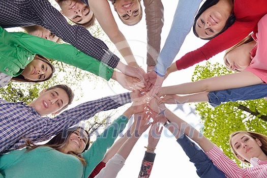 Happy smiling group of young friends staying together outdoor in the park Happy smiling group of young friends staying together outdoor in the park