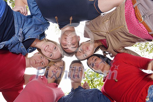 Happy smiling group of young friends staying together outdoor in the park Happy smiling group of young friends staying together outdoor in the park