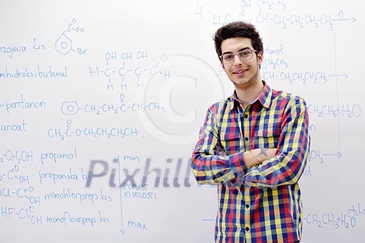 happy young teenage boy portrait in school on chemistry classes and library happy young teenage boy portrait in school on chemistry classes and library