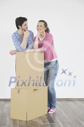 happy Young couple moving in new home happy Young couple moving in new home