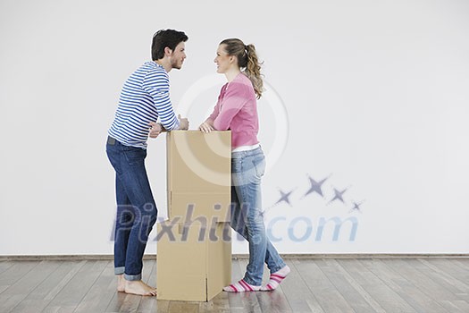 happy Young couple moving in new home happy Young couple moving in new home