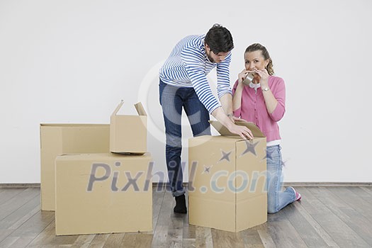 happy Young couple moving in new home happy Young couple moving in new home