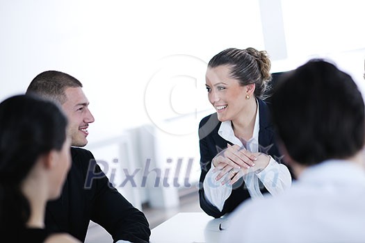 Group of happy young business people in a meeting at office Group of happy young business people in a meeting at office