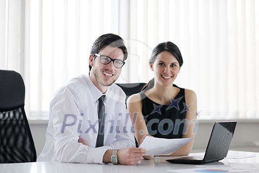 Group of happy young business people in a meeting at office Group of happy young business people in a meeting at office