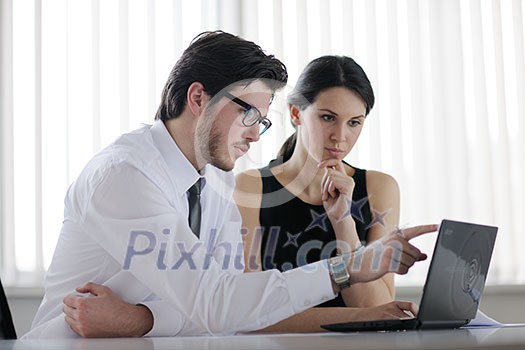 Group of happy young business people in a meeting at office Group of happy young business people in a meeting at office