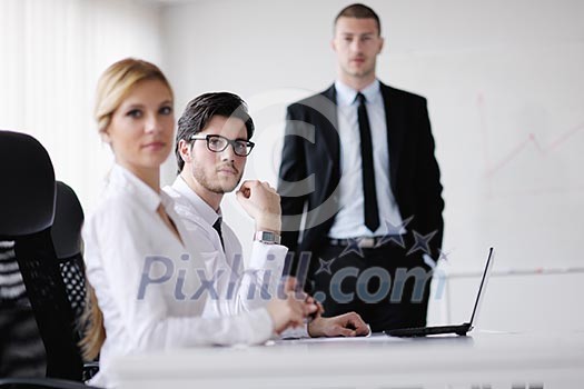 Group of happy young business people in a meeting at office Group of happy young business people in a meeting at office