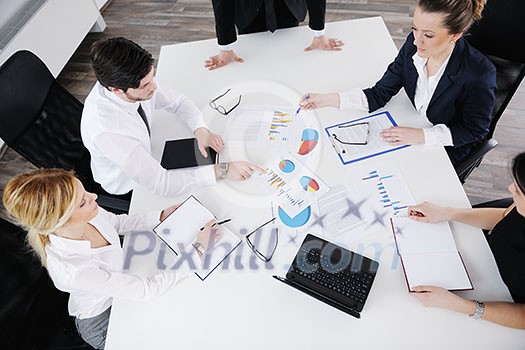 Group of happy young business people in a meeting at office Group of happy young business people in a meeting at office