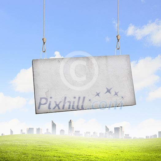 Image of cement blank banner hanging on ropes Image of cement blank banner hanging on ropes