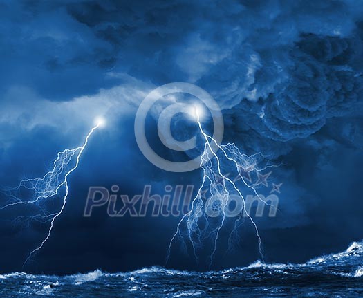 Image of dark night with lightning above stormy sea