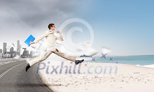Image of businessman running away from office work Image of businessman running away from office work