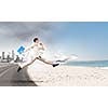 Image of businessman running away from office work