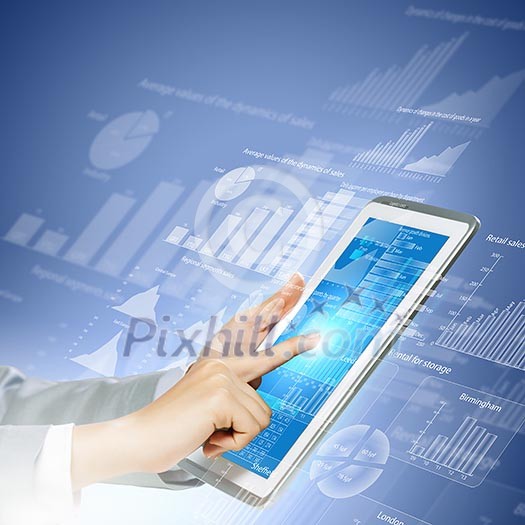 Close up image of human hand touching screen of tablet pc Close up image of human hand touching screen of tablet pc