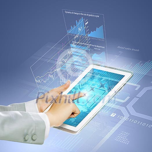 Close up image of human hand touching screen of tablet pc Close up image of human hand touching screen of tablet pc