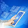 Close up image of human hand touching screen of tablet pc
