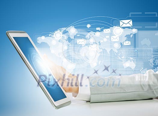 Close up image of human hand touching screen of tablet pc Close up image of human hand touching screen of tablet pc