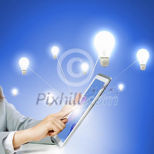 Close up image of human hand touching screen of tablet pc Close up image of human hand touching screen of tablet pc