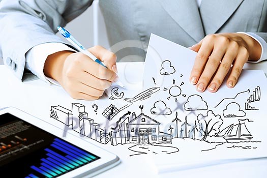 Image of businesswoman sitting at table and drawing sketch Image of businesswoman sitting at table and drawing sketch