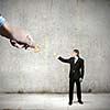 Miniature of businessman getting one cent from someone