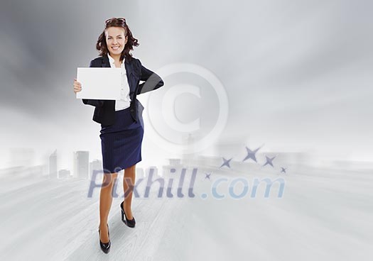 Top view of smiling businesswoman holding white blank banner. Place for text Top view of smiling businesswoman holding white blank banner. Place for text