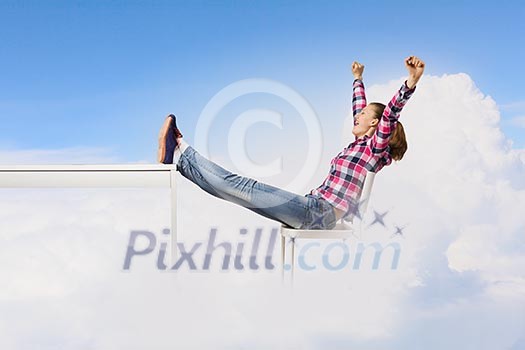 Young woman in casual with arms up celebrating success Young woman in casual with arms up celebrating success