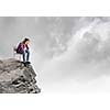 Young woman in casual sitting in chair on top of rock