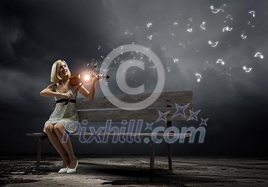 Young woman sitting on bench and playing violin Young woman sitting on bench and playing violin