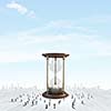 Conceptual image with sandglass and silhouettes of business people around