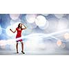 Woman in red dress against bokeh background