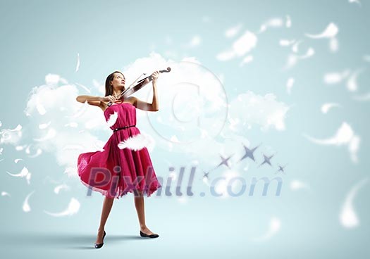 Young attractive woman in red dress playing violin Young attractive woman in red dress playing violin