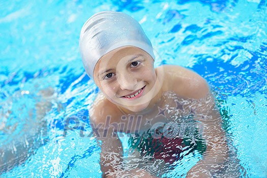 happy little child portrait on swimming school classes and recreation at indoor pool happy little child portrait on swimming school classes and recreation at indoor pool