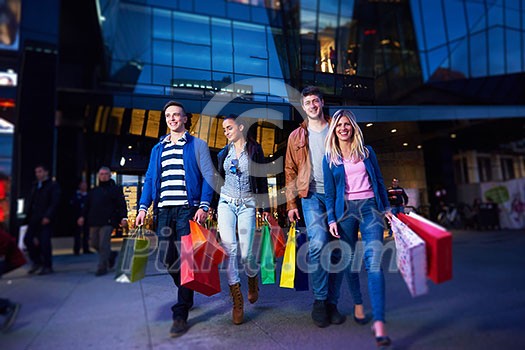 Group Of Friends Enjoying Shopping Trip Together
group of happy young frineds enjoying shopping night and walking on steet on night in with mall in background Group Of Friends Enjoying Shopping Trip Together
group of happy young frineds enjoying shopping night and walking on steet on night in with mall in background