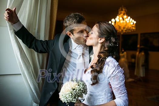 Gorgeous wedding couple kissing Gorgeous wedding couple kissing