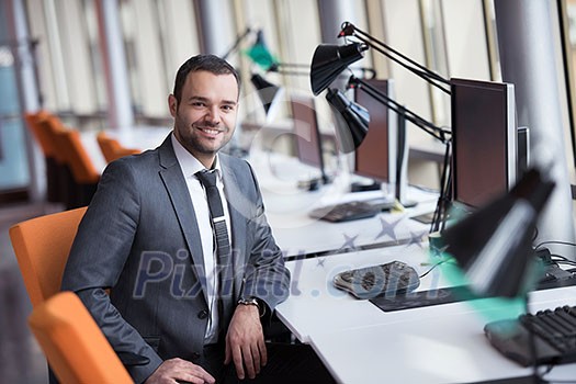 happy young business man portrait in bright modern office indoor happy young business man portrait in bright modern office indoor