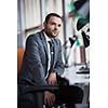 happy young business man portrait in bright modern office indoor