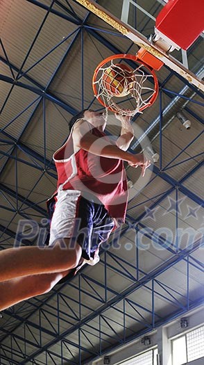 young healthy man play basketball game indoor in gym young healthy man play basketball game indoor in gym