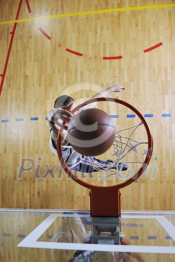 young healthy man play basketball game indoor in gym young healthy man play basketball game indoor in gym