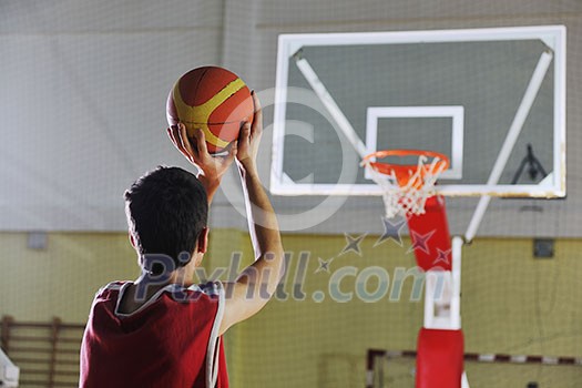 young healthy man play basketball game indoor in gym young healthy man play basketball game indoor in gym
