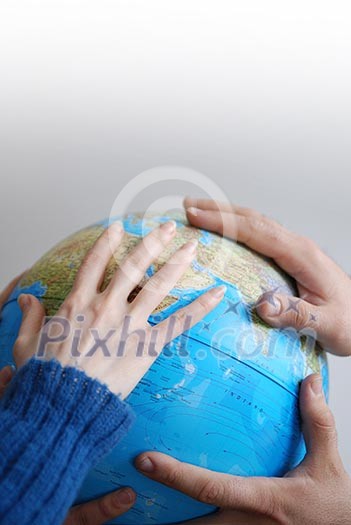 Teamwok concept with hands on globe (NIKON D80; 20.3.2007; 1/40 at f/2.8; ISO 400; white balance: Auto; focal length: 35 mm) Teamwok concept with hands on globe (NIKON D80; 20.3.2007; 1/40 at f/2.8; ISO 400; white balance: Auto; focal length: 35 mm)