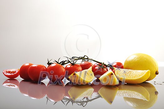 fresh lemon and tomato fruit isolated on white fresh lemon and tomato fruit isolated on white