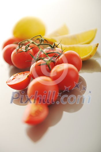 fresh lemon and tomato fruit isolated on white fresh lemon and tomato fruit isolated on white