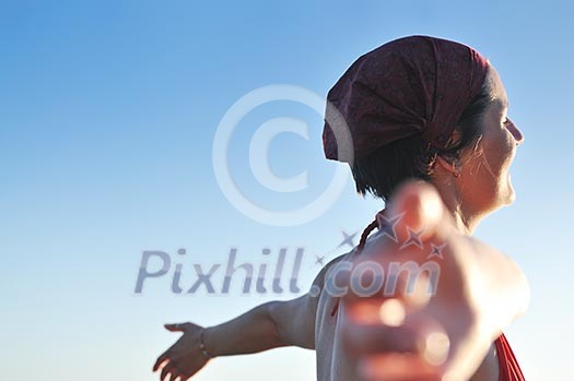 happy girl spreading hands and enjoy in sunlight at summer vacation happy girl spreading hands and enjoy in sunlight at summer vacation