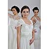 portrait of a three beautiful woman in wedding dress, bride and her friends bridesmaid